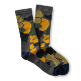 Duck Head Merino Wool Sock crew socks in a dark camo pattern with yellow accents and solid gray and navy blue heels and toes.