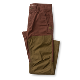 Brown and olive green Duck Head Field Canvas Briar Pant with reinforced panels on the front of the legs for abrasion resistance.