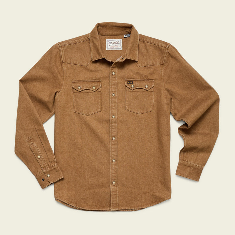 The Dust Up Denim Snapshirt by Howler Brothers is a long-sleeve brown button-up with two chest pockets, made from 100% cotton denim, shown laid flat on a light background.