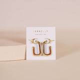 JaxKelly’s Brown Enamel Large Rectangle Gold Hoop Earrings are displayed on a white JaxKelly card against a neutral background, perfect for those seeking stylish, hypoallergenic accessories.