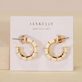 The JaxKelly Vintage Hoop Earrings are hypoallergenic, tarnish-free gold and enamel hoops displayed on a "Wear Good Vibes" card—perfect for sensitive ears and daily shine.