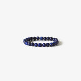 The Earth Bracelet - Blue Lapis by BRANCO features round, dark blue lapis beads in a single strand, shown on a plain white background.