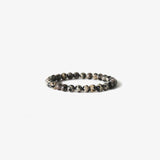 The Earth Bracelet - Dalmatian Stone by BRANCO features round Dalmatian stone beads, beautifully arranged in a circle against a white background.
