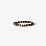 The BRANCO Earth Bracelet - Gold Tiger Eye features polished round tiger eye and black gemstones, looped together and displayed on a plain white background.