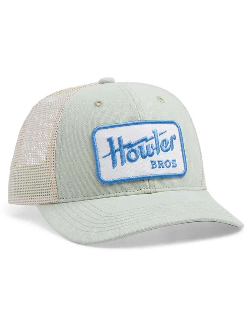 The Electric Standard Hat by Howler Brothers is a light-colored mesh trucker with a solid front and brim, blue and white "Howler Bros" patch, medium crown, adjustable fit, and is part of the Howler Brothers hat collection.