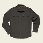 The Howler Brothers Emerger Tech Longsleeve in dark gray, with UPF 35, two chest pockets, a zippered pocket, and a collar, is shown laid flat on a light background.