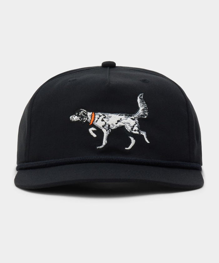 The Duck Camp English Setter Hat is a black adjustable cap with an embroidered dog in an orange collar on the front, made from a durable polyester shell.