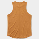 The Essential drirelease® Tank by Duck Camp, a sleeveless mustard quick-dry top, is laid flat and displayed from the back on a white background.