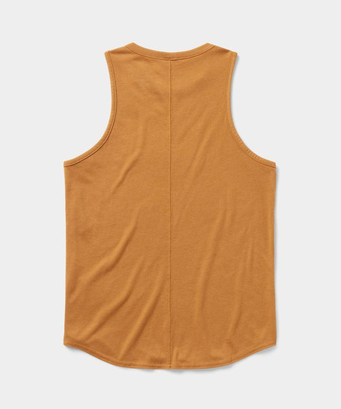 The Essential drirelease® Tank by Duck Camp, a sleeveless mustard quick-dry top, is laid flat and displayed from the back on a white background.