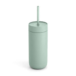 The Fellow Carter Cold Tumbler is a light green, cylindrical double wall vacuum insulated tumbler with a matching lid and straw, shown standing upright on a white background.