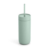 The Fellow Carter Cold Tumbler is a light green, cylindrical double wall vacuum insulated tumbler with a matching lid and straw, shown standing upright on a white background.