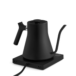 The Fellow Electric Kettle in matte black features a precision pour spout and base, displayed against a plain white background.