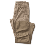 The Duck Head Field Canvas Briar Pant, in light brown with abrasion resistance and reinforced knee patches, is folded neatly on a white background—ideal for outdoor adventures.