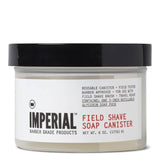 The Imperial Barber Products Field Shave Soap Canister is a plastic container with a black lid, ideal for travel. It features product details on the front and is enriched with glycerin for a smooth shave.
