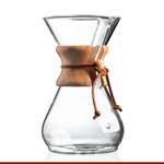 The Chemex Filter Drip Coffeemaker (CM-8A) by Chemex, featuring a clear glass design with a wooden collar and leather tie, offers a 40 oz capacity and is showcased on a white background.