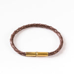 The Flint Single Waxed Canvas Bracelet by Tres Cuervos features a sleek magnetic clasp and is shown on a white background.
