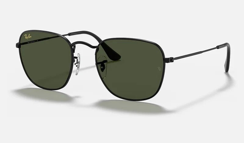 Ray-Ban Frank sunglasses featuring black metal frames with green lenses, thin arms, and adjustable nose pads.