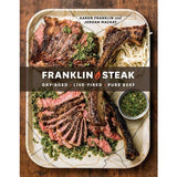 Cover of "Franklin Steak" by Penguin, showing two plates of sliced steak with green sauce and noodles; authors Aaron Franklin and Jordan Mackay reveal expert grilling techniques.
