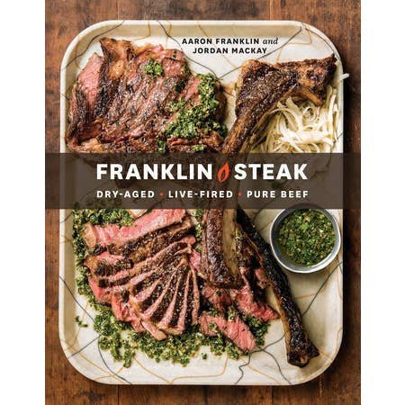 Cover of "Franklin Steak" by Penguin, showing two plates of sliced steak with green sauce and noodles; authors Aaron Franklin and Jordan Mackay reveal expert grilling techniques.