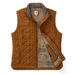 The Fremont Sport Performance Quilted Vest by Duck Head features a brown quilted design with a gray collar, zippered front, nature-themed inner lining, and lightweight PrimaLoft Black Insulation for warmth.