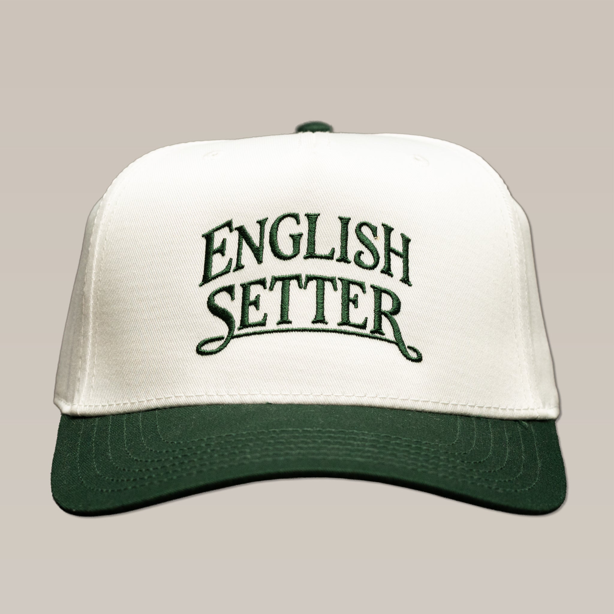 Ballad Originals Bird Dog Series Hat | English Setter, a white baseball cap with a dark green brim and “English Setter” embroidered in green, crafted with Texas craftsmanship.