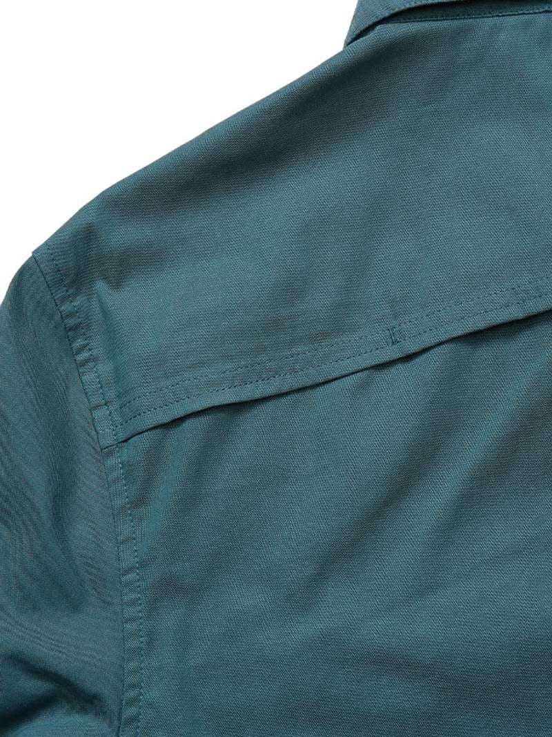 Close-up of the upper back section of the teal Gaucho Snapshirt | Enter the Dragons by Howler Brothers, highlighting the yoke seam and part of the collar.