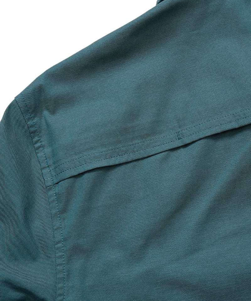 Close-up of the upper back section of the teal Gaucho Snapshirt | Enter the Dragons by Howler Brothers, highlighting the yoke seam and part of the collar.