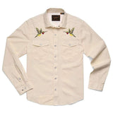The Gaucho Snapshirt | Nectar Seekers by Howler Brothers is a cream long-sleeve shirt with snap buttons and embroidered hummingbirds on the chest pockets, inspired by classic western shirts.