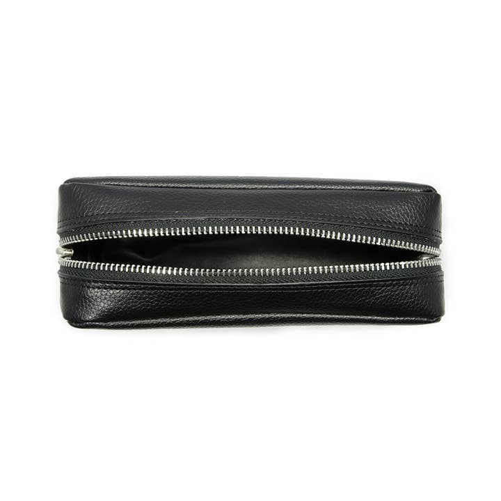 The Rockwell Razors Genuine Leather Dopp Kit, shown from above with a partially open zipper on a white background, is perfect for organizing your grooming essentials.