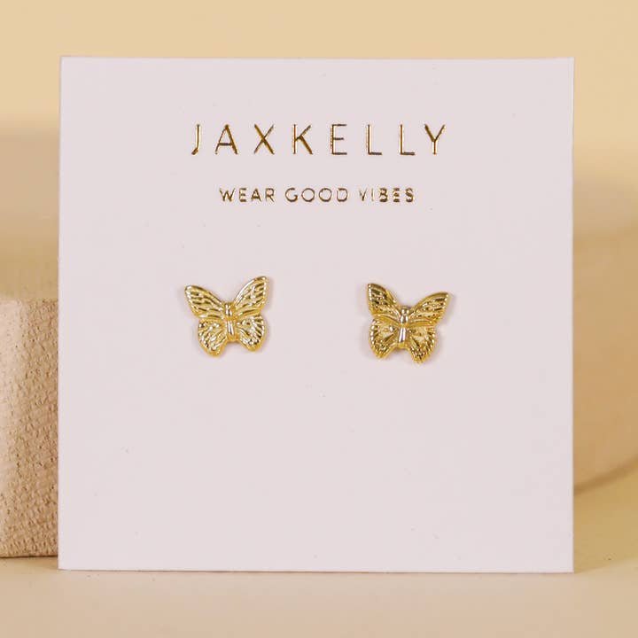 Gold Butterfly Stud Earrings by JaxKelly, tarnish free and presented on a branded card with “Wear Good Vibes” text.