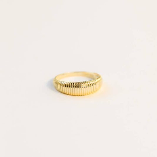 The Gold Ring - Ridged by JaxKelly features a textured design and is shown on a plain, light background. This hypoallergenic ring is crafted to be tarnish-free, offering lasting shine and comfort.