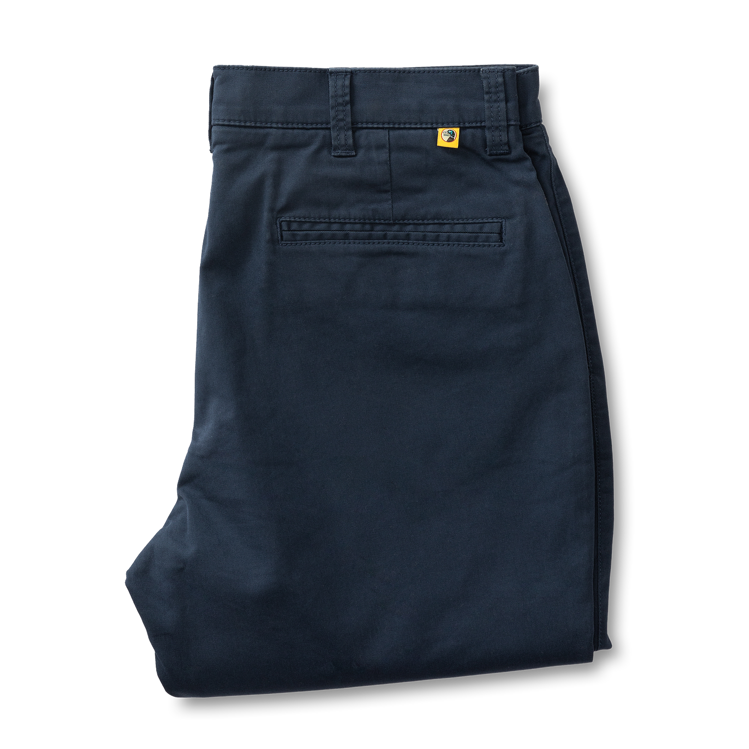 A neatly folded pair of Duck Head Gold School Chino pants in dark blue cotton twill with belt loops, a back pocket, and a small yellow tag near the waistband.
