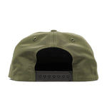 Back view of the Duck Camp Grandpa Hat in olive green, featuring an embroidered bass and a black adjustable snapback closure.