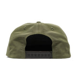 Back view of the Duck Camp Grandpa Hat in olive green, featuring an embroidered bass and a black adjustable snapback closure.