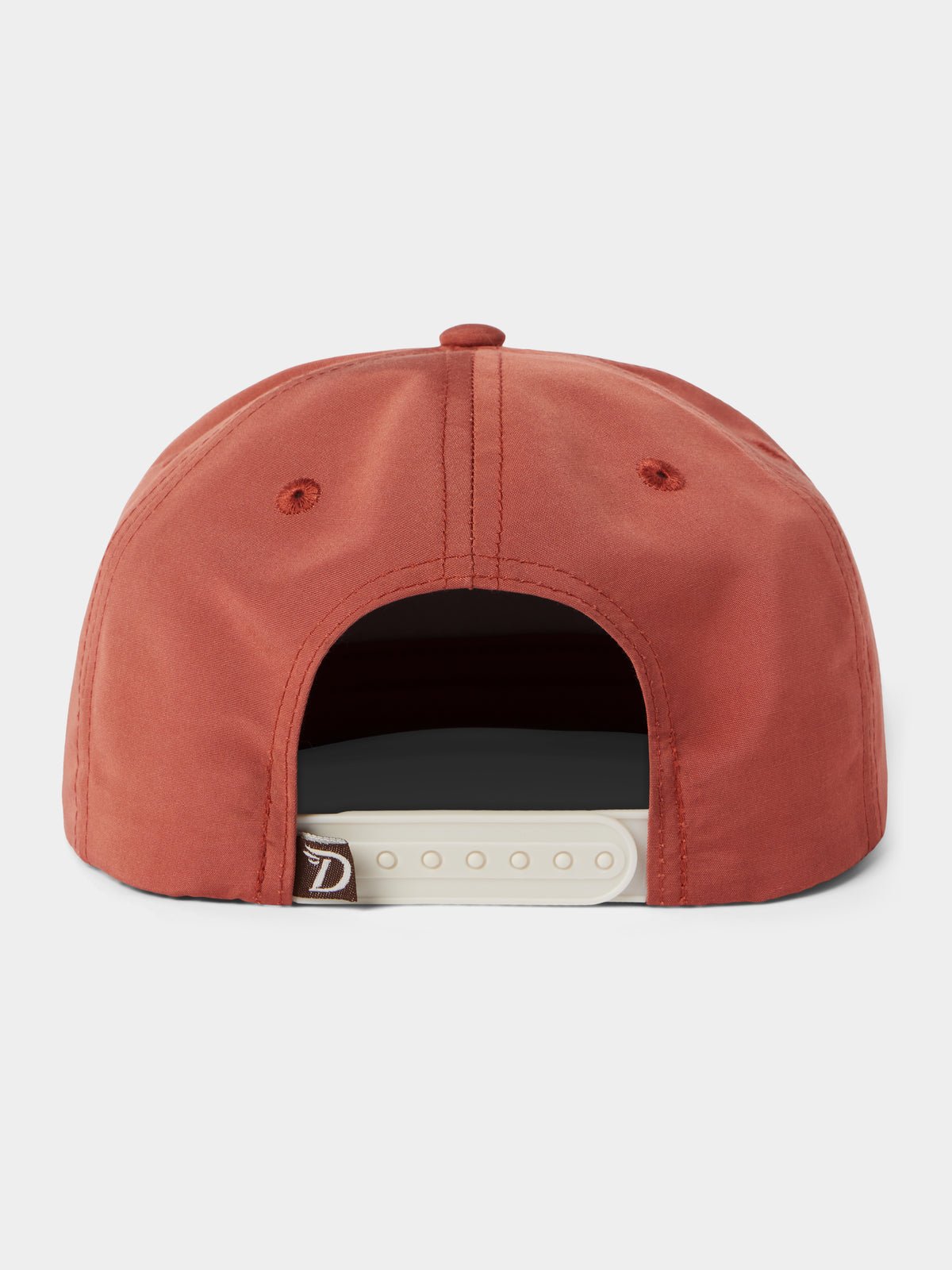 The Duck Camp Grandpa Hat | Bass Trinity is a rust-colored snapback with a white adjustable closure, two embroidered eyelets, and a durable polyester shell.