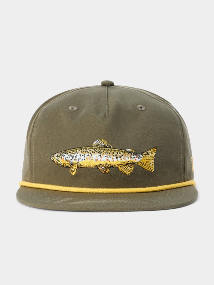 The Grandpa Hat Brown Trout by Duck Camp features an olive green snapback with a yellow rope, an embroidered fish on the front, and an adjustable closure. Its durable polyester shell ensures comfort and longevity.