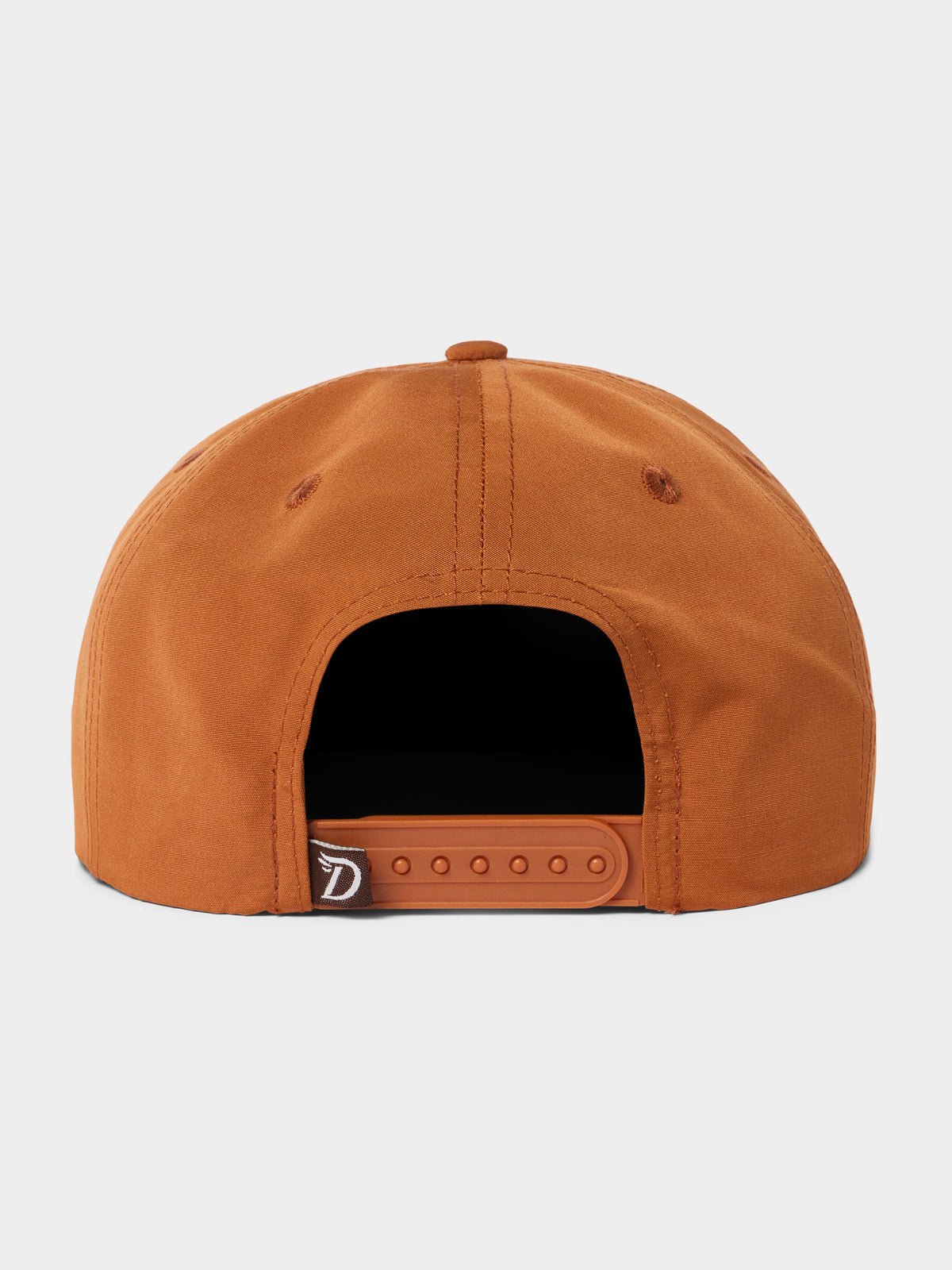 Back view of the Duck Camp Grandpa Hat in Dove, featuring an orange snapback with an adjustable plastic snap closure and a small black tag on the left side.