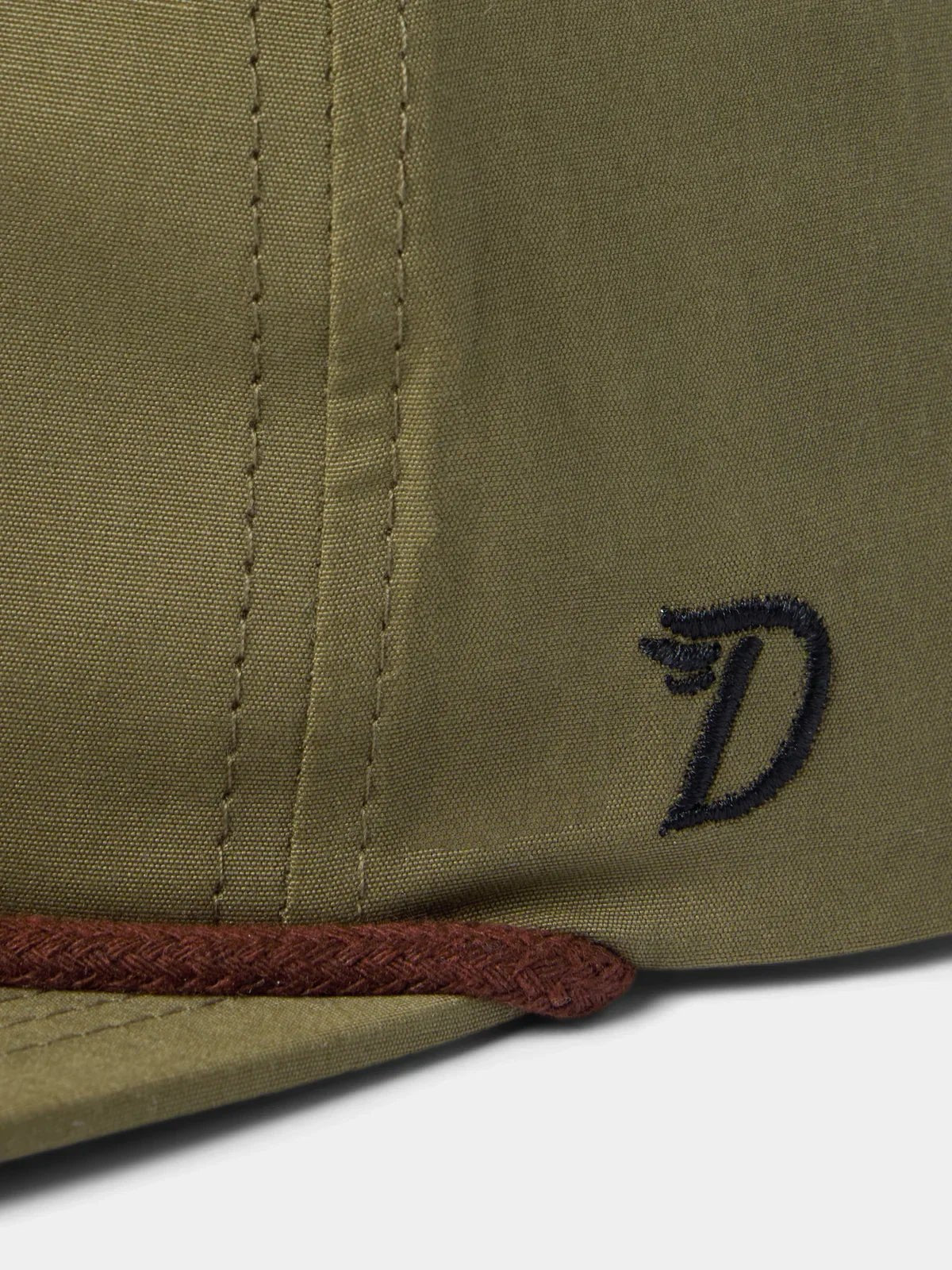 Close-up of the Duck Camp Grandpa Hat in olive green with a brown trim, featuring a black embroidered "D" on the side. Part of the Gator collection.