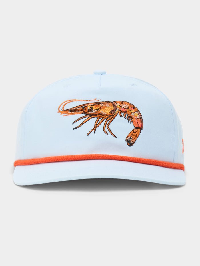 The Duck Camp Grandpa Hat Gulf Shrimp features a light blue 5-panel design, an embroidered orange shrimp on the front, orange brim trim, and an adjustable snapback for a perfect fit.