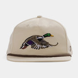 The Duck Camp Grandpa Hat | Mallard features a beige design with an embroidered duck in flight on the front, brown brim trim, and an adjustable fit for comfort.