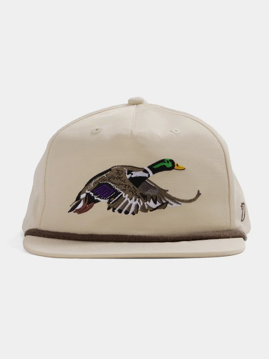 The Duck Camp Grandpa Hat | Mallard features a beige design with an embroidered duck in flight on the front, brown brim trim, and an adjustable fit for comfort.