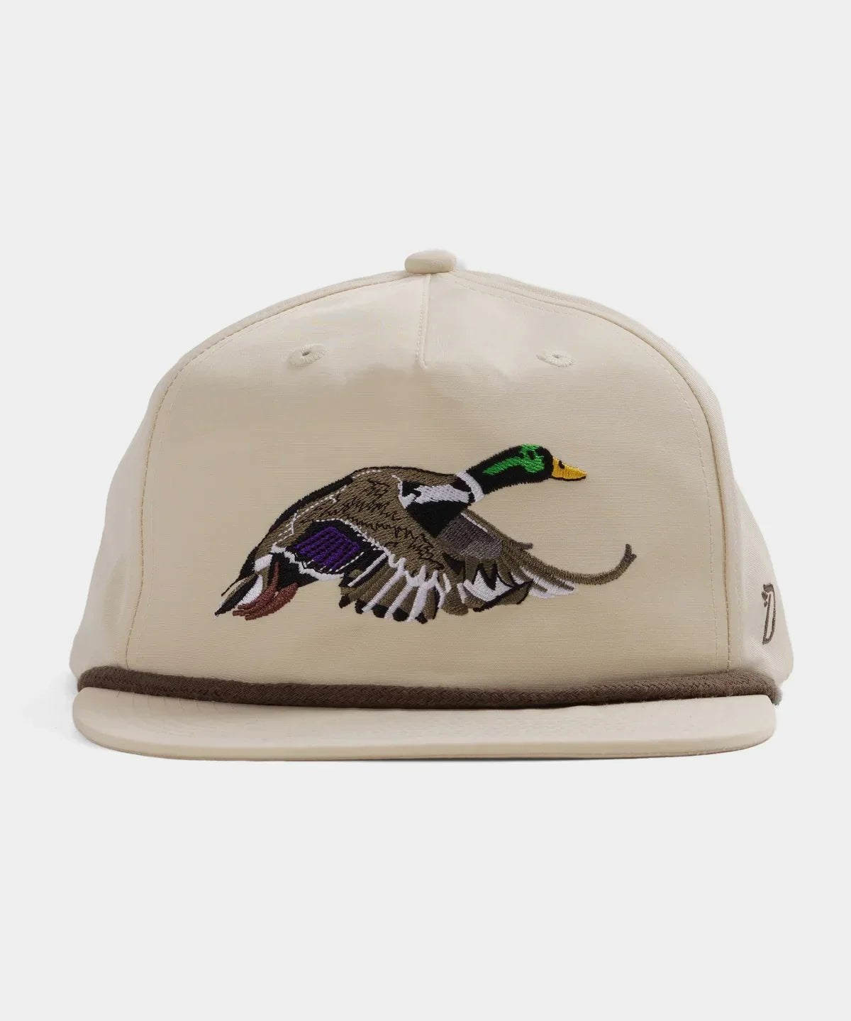 The Grandpa Hat | Mallard by Duck Camp is a beige hat with an embroidered flying duck, featuring an adjustable snapback and durable polyester shell.