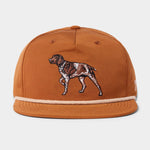 The Duck Camp Grandpa Hat | Pointer is a rust-colored 5-panel cap with an embroidered brown and white dog on the front and an adjustable snapback for a comfortable fit.