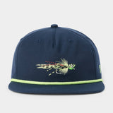 The Grandpa Hat Popper by Duck Camp is a navy blue 5-panel snapback featuring a green fishing fly embroidered on the front and a light green trim along the adjustable visor.
