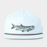 The Duck Camp Grandpa Hat Tarpon is a light blue 5-panel hat with an embroidered fish on the front, a thin dark trim above the brim, and an adjustable snapback for comfort.
