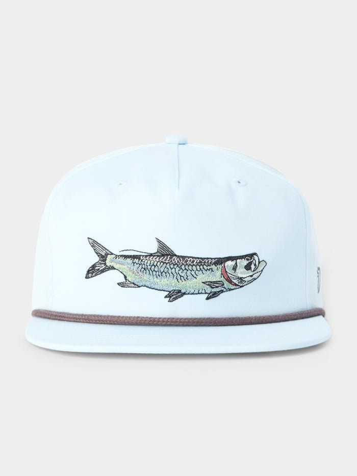 The Duck Camp Grandpa Hat Tarpon is a light blue 5-panel hat with an embroidered fish on the front, a thin dark trim above the brim, and an adjustable snapback for comfort.