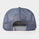 The Gulf Trucker | Cast & Blast by Duck Camp is a blue mesh hat shown from the back, featuring an adjustable snapback closure and a small fabric tag on the left side for added detail.