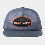 The Gulf Trucker | Cast & Blast by Duck Camp is a blue mesh hat featuring an adjustable snapback and a front patch that reads "Duck Camp" and "We Make Outdoor Goods So You Can Outdoor Good, Established 2017.