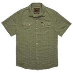 The H Bar B Snapshirt by Howler Brothers is an olive green, short-sleeve button-up with pearl snaps, two chest pockets, and a textured vertical stripe pattern.