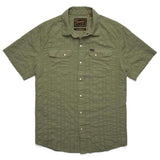 The H Bar B Snapshirt by Howler Brothers is an olive green, short-sleeve button-up with pearl snaps, two chest pockets, and a textured vertical stripe pattern.